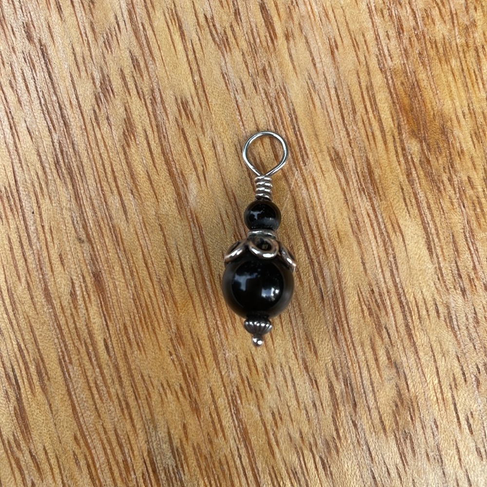 Smooth round black stone bead pendant